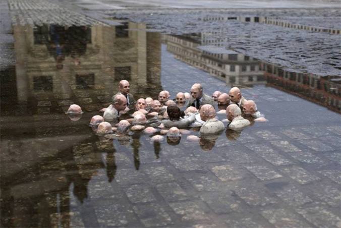 politicans-discussing-global-warming-sculpture-by-issac-cordal-berlin